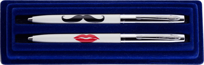 Cap-o-matic space pens with white plastic barrels, chrome caps, clips, and tips in a blue gift box. One pen is imprinted with a black mustache; the other is imprinted with a red kiss.